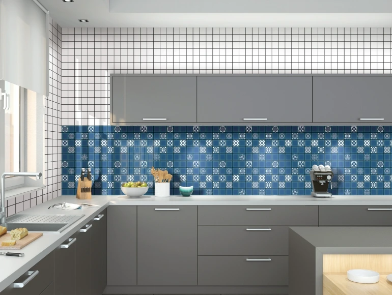 Stylish kitchen backsplash design with blue Moroccan mosaic tiles, grey cabinetry, and white grid wall tiles.